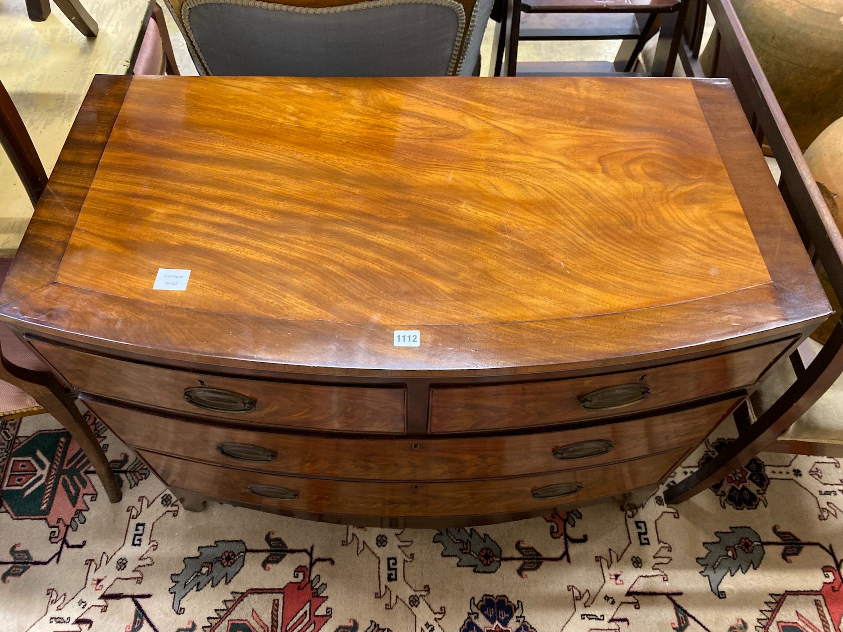 A Regency banded mahogany bow fronted chest of drawers, width 104cm, depth 53cm, height 85cm